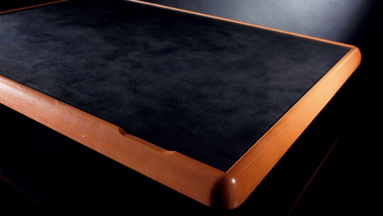 first table with a raised edge 